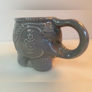 Grey ceramic elephant mug with trunk handle